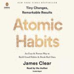 The cover of the book atomic habits by james clear.