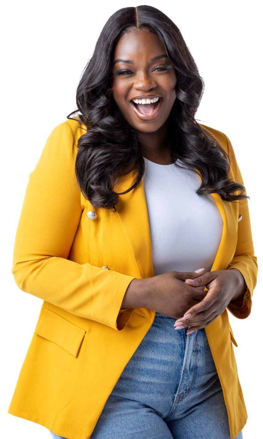 A woman wearing a yellow jacket and jeans is smiling.