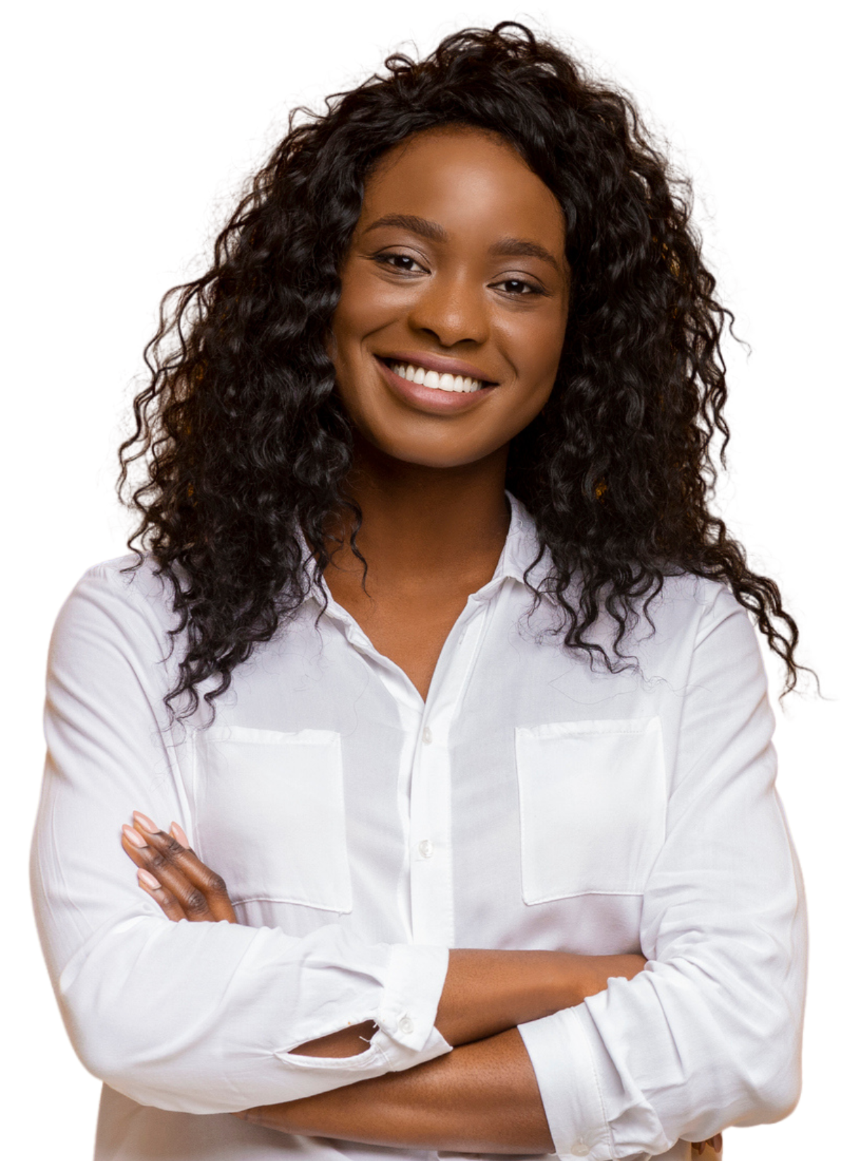 A woman in a white shirt and jeans is smiling with her arms crossed.