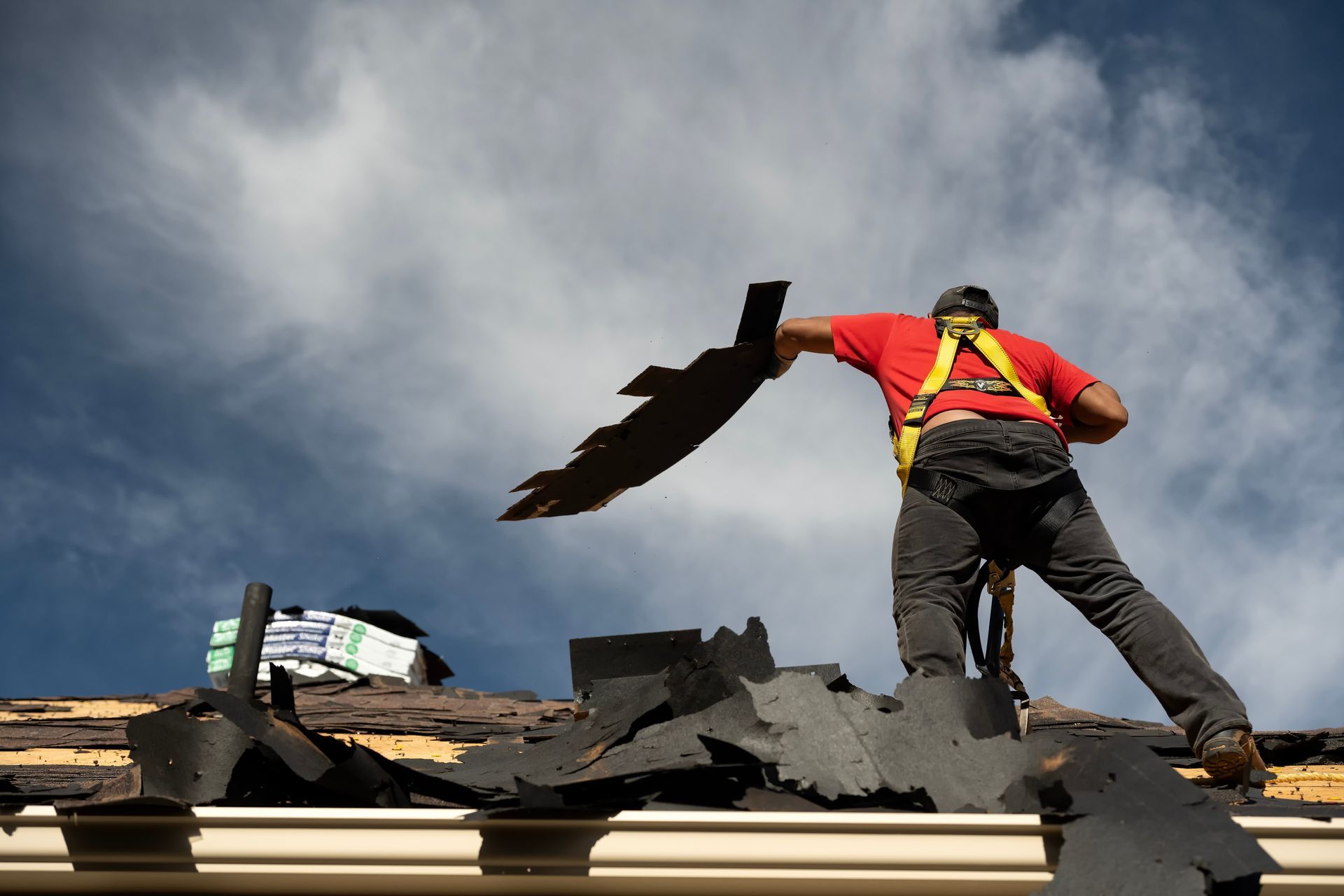 Reroofing house after hailstorm.