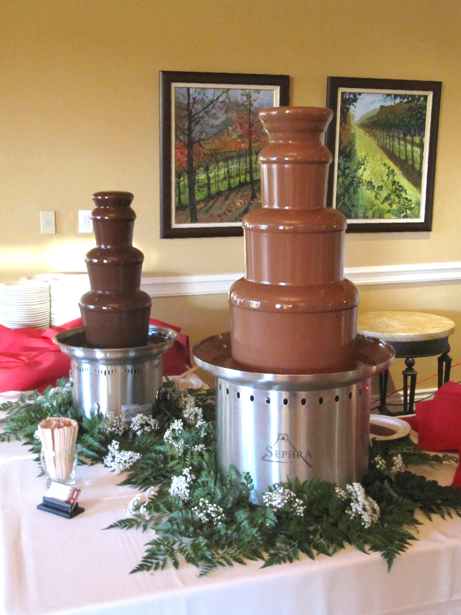 A table with a chocolate fountain on it