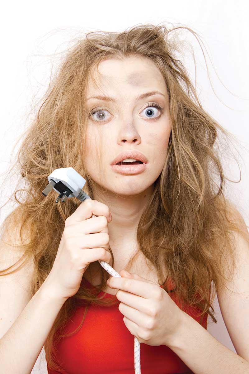 humorous photograph of person holding 13A plug & flex