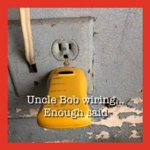 A yellow object is plugged into an electrical outlet and says uncle bob wiring enough said