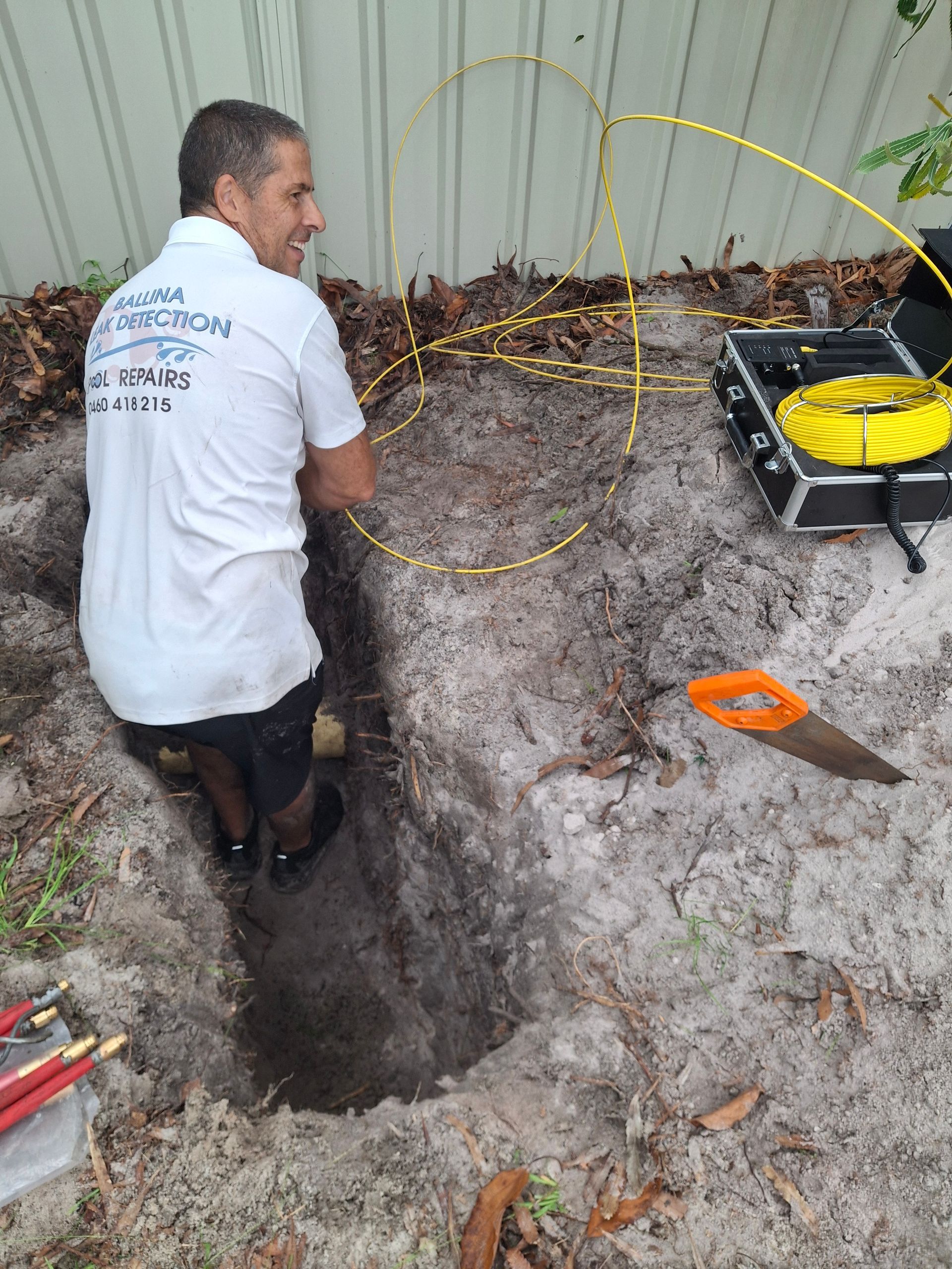 Man Wearing Headphones Uses a Leak Detection Device — Ballina Leak Detection & Swimming Pool Repairs in Ballina, NSW
