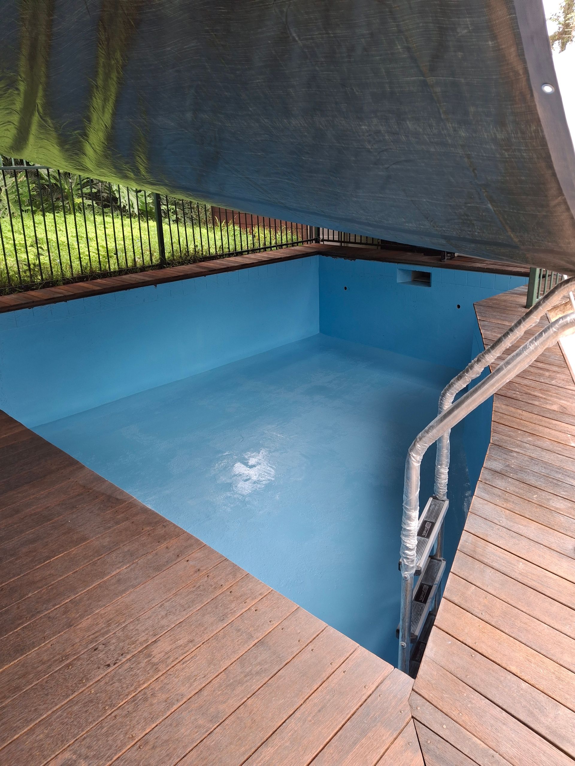 Green Algae Growth on The Steps of A Swimming Pool — Ballina Leak Detection & Swimming Pool Repairs in Ballina, NSW