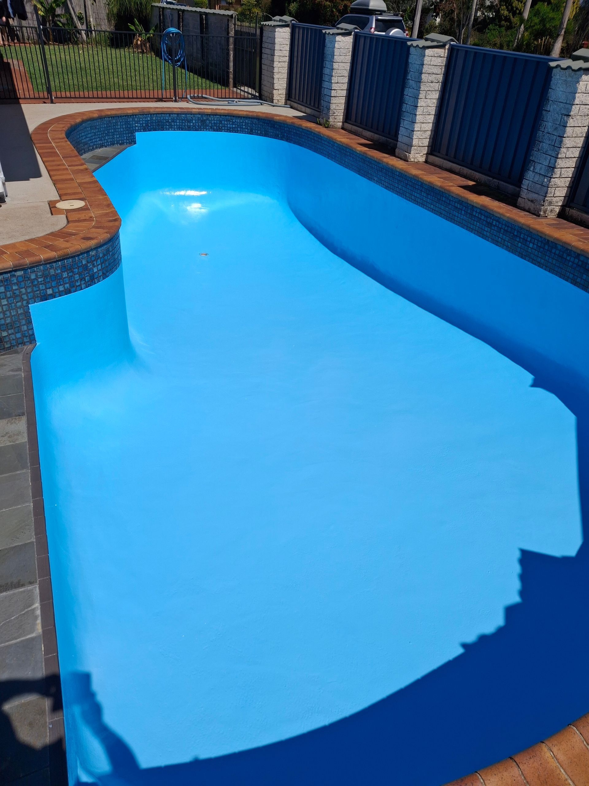 Blue Pool Vacuum Cleaning a Turquoise Pool — Ballina Leak Detection & Swimming Pool Repairs in Ballina, NSW