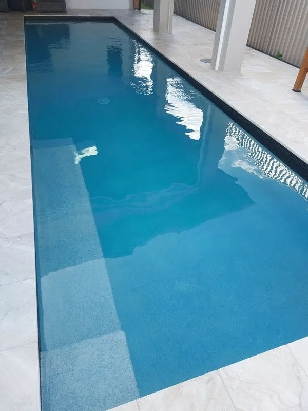 Long, Narrow Swimming Pool With Blue Water — Ballina Leak Detection & Swimming Pool Repairs in Ballina, NSW