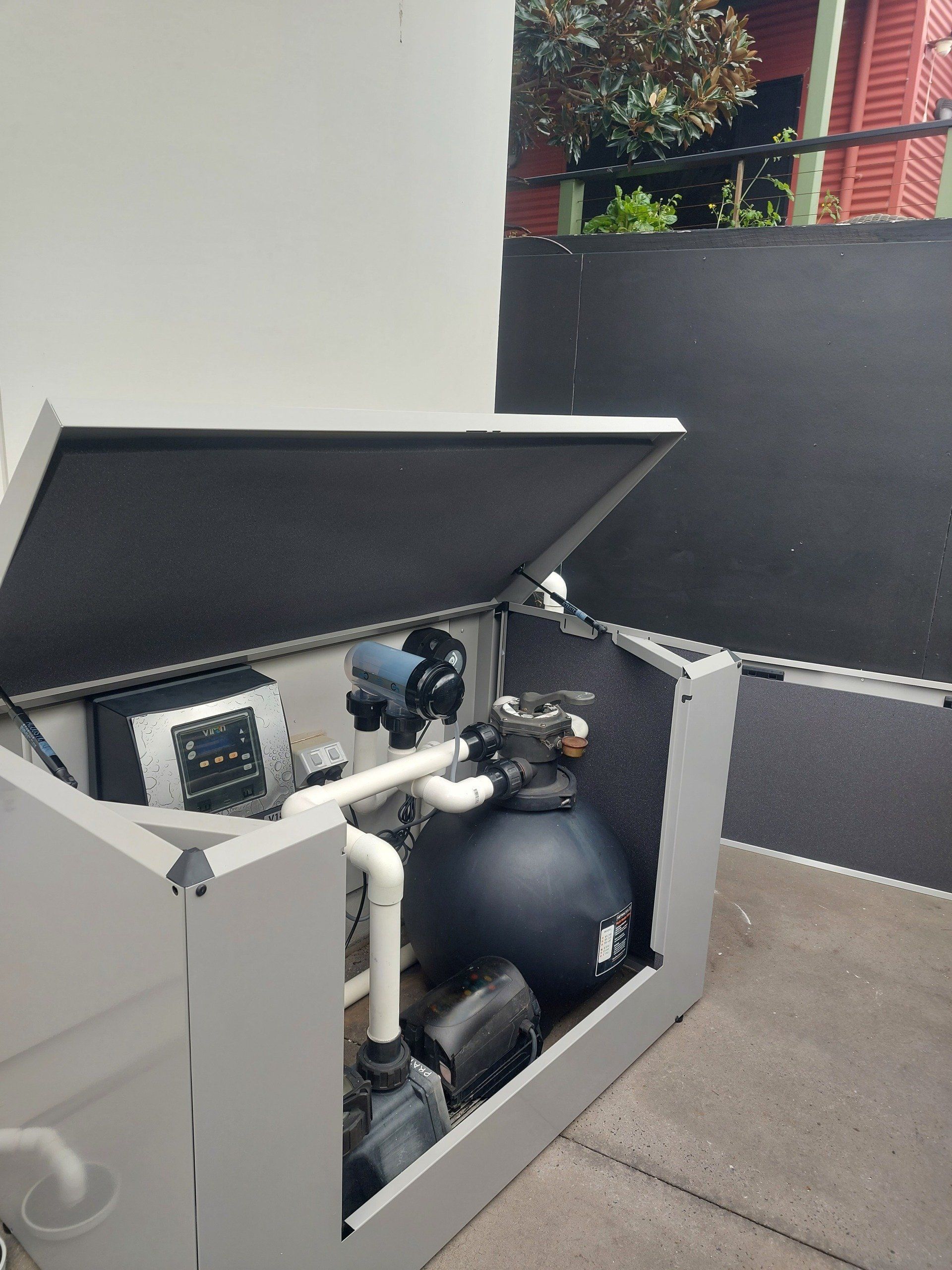 Pool Filter Equipment Inside a Gray Enclosure with The Lid Open — Ballina Leak Detection & Swimming Pool Repairs in Ballina, NSW