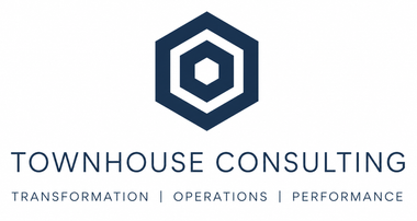 Townhouse Estates logo with a navy geometric hexagon icon above the company name.