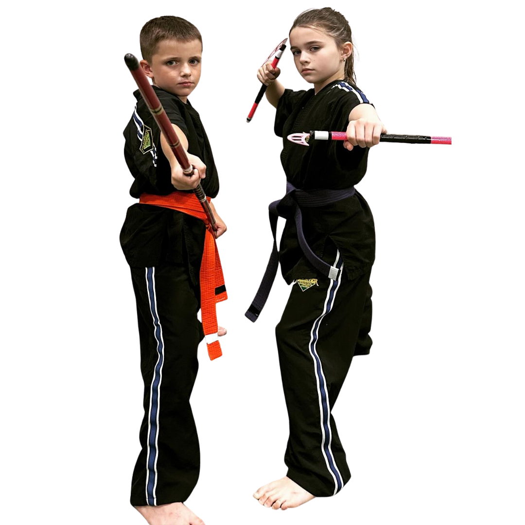 A boy and two girls are wearing karate uniforms and pointing at the camera