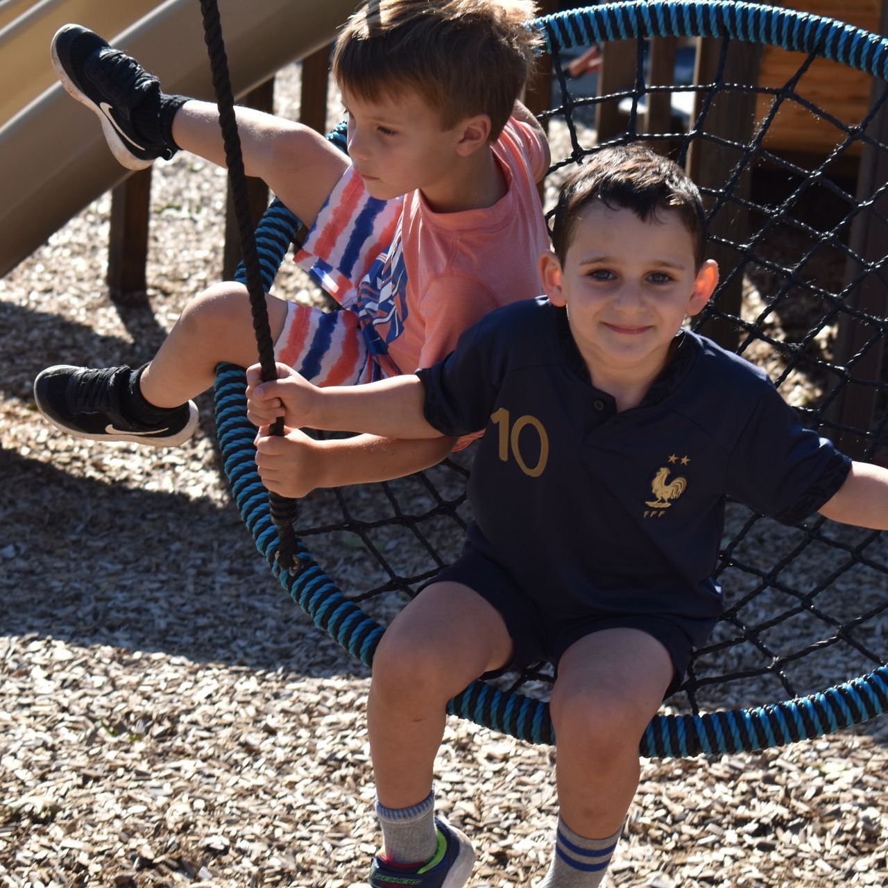 A boy wearing a shirt with the number 10 on it