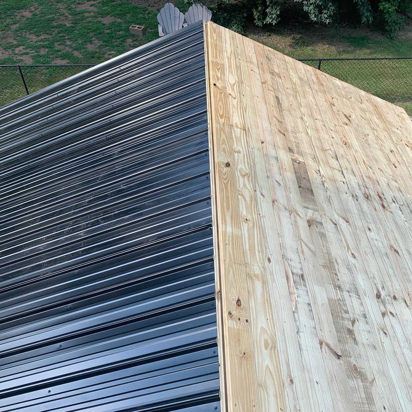 A roof with a metal roof and a wooden roof.