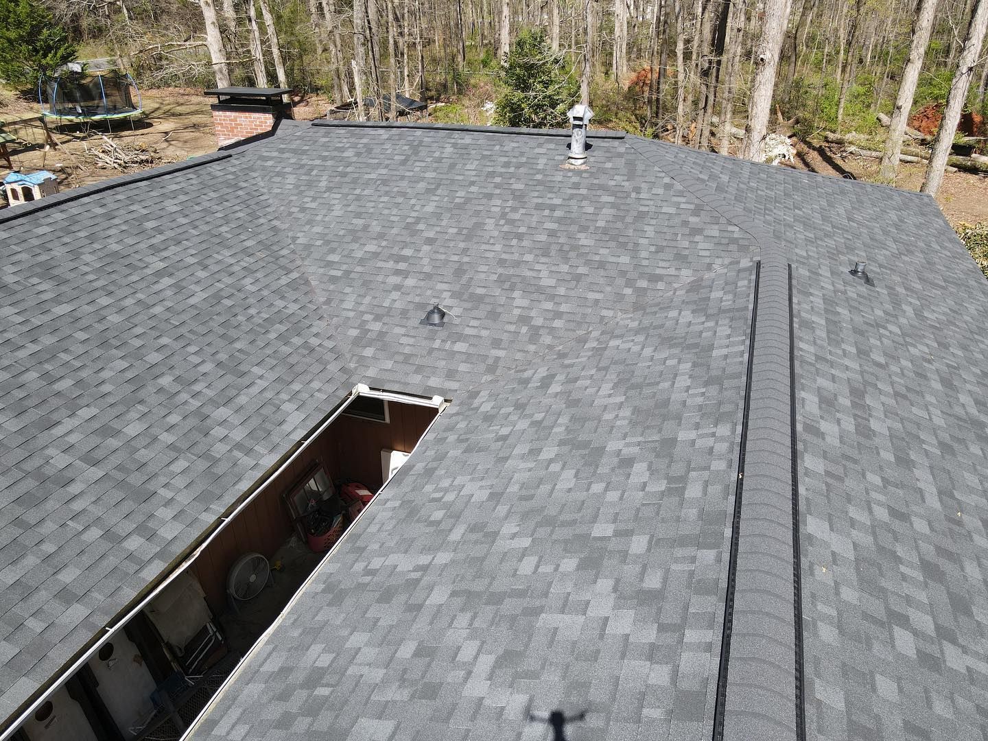 An aerial view of a roof with a hole in the middle of it.