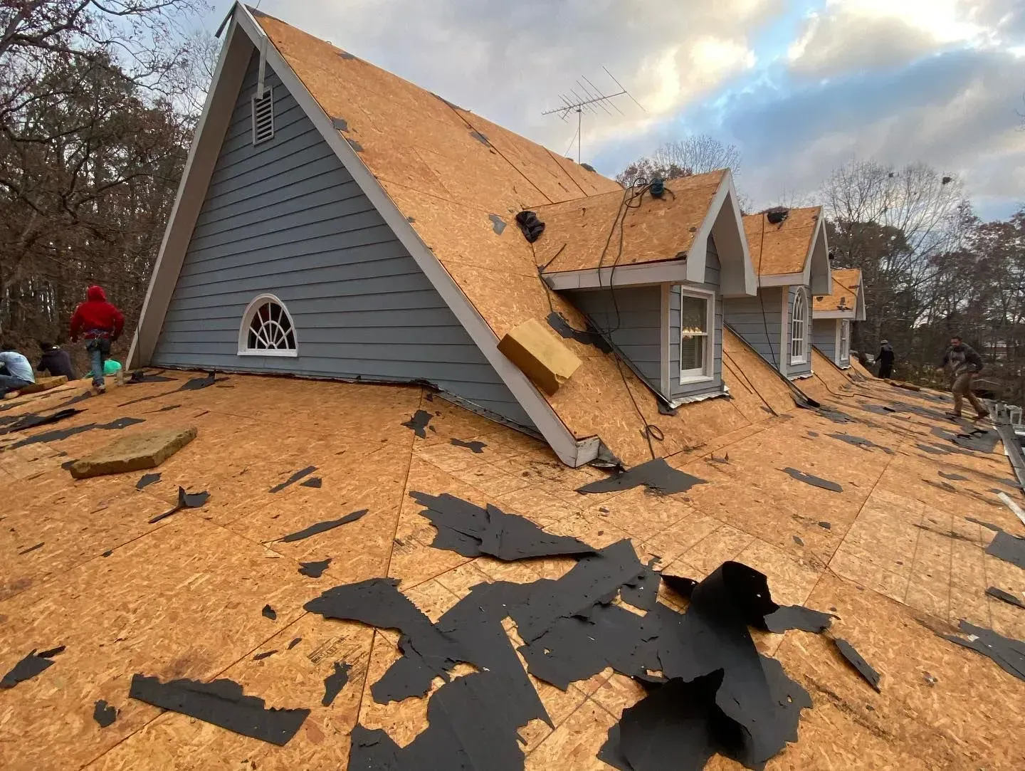 A house with a roof that is being repaired.