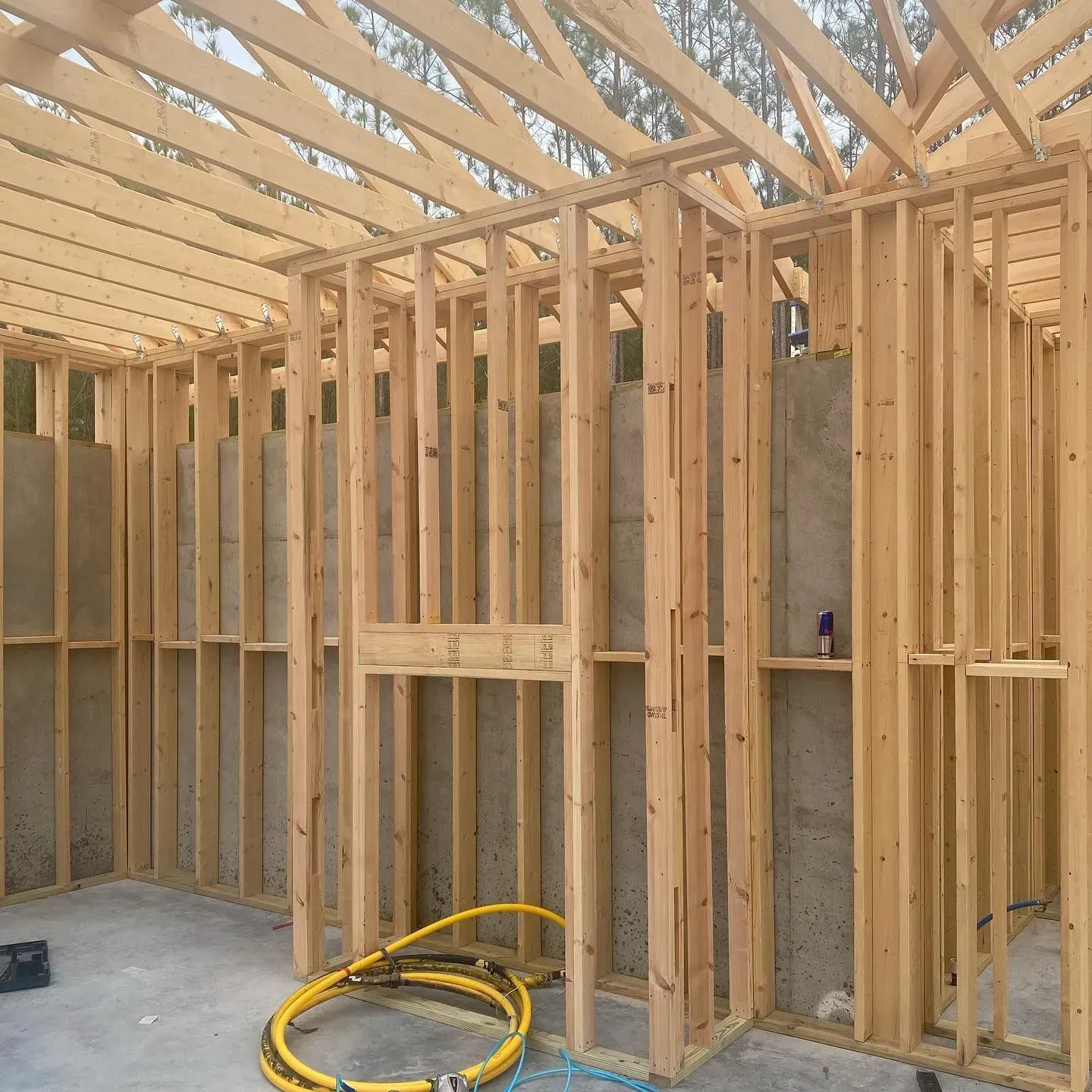A wooden frame of a building under construction