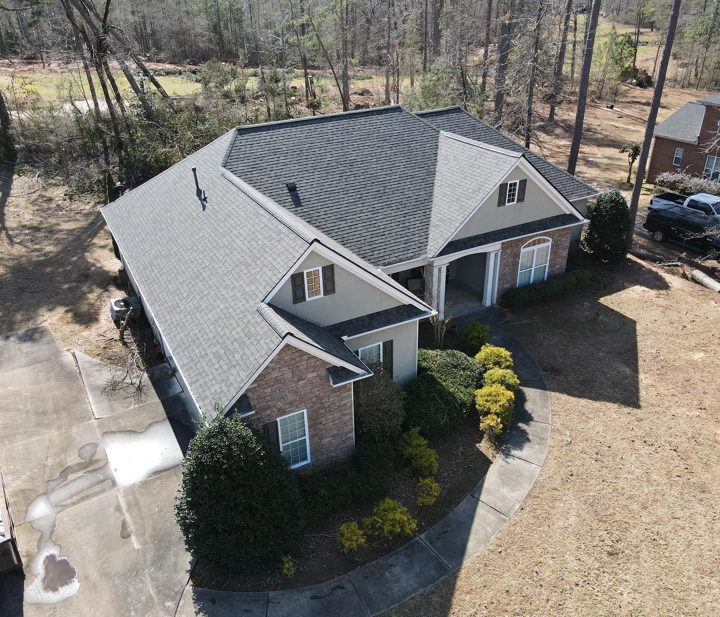 An aerial view of a house with a new roof