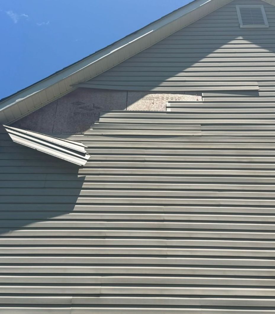 A close up of a house with a blue sky in the background
