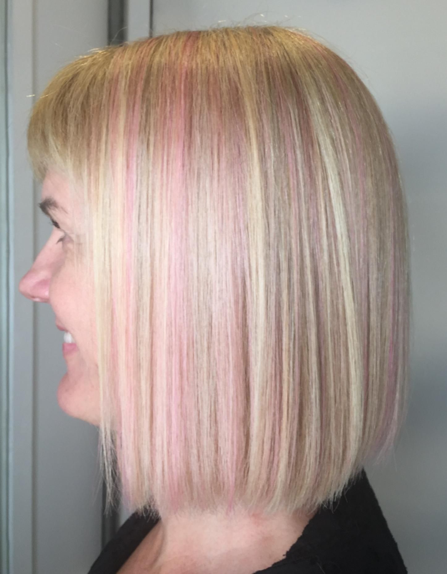 A Woman With Blonde And Pink Hair Is Wearing A Black Shirt — Fuse Hair & Beauty In Darwin City, NT