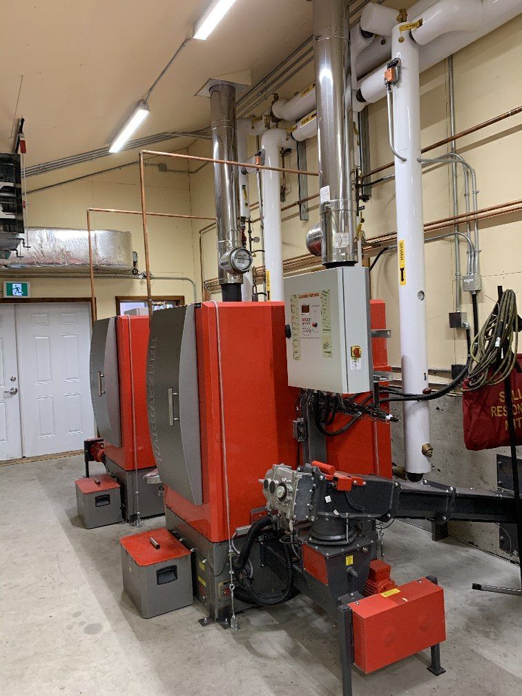 A room with a lot of machinery and a sign that says r on it