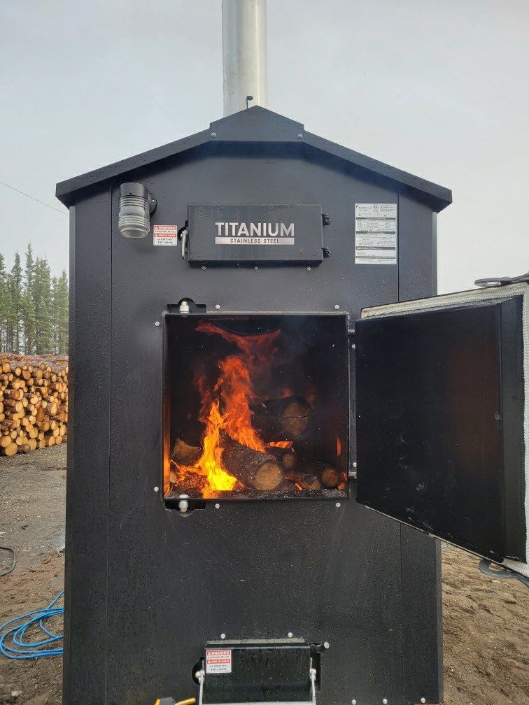 A titanium wood stove with the door open