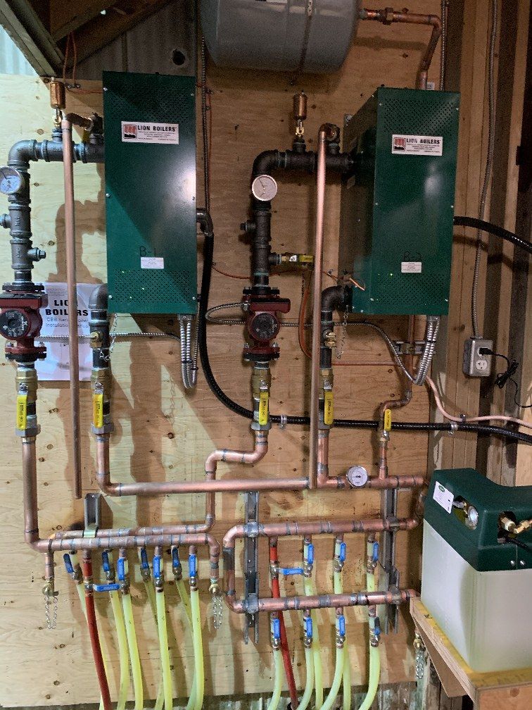 A bunch of pipes are hanging on a wall in a room.