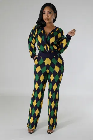 A woman is wearing a green and yellow jumpsuit with a diamond pattern.