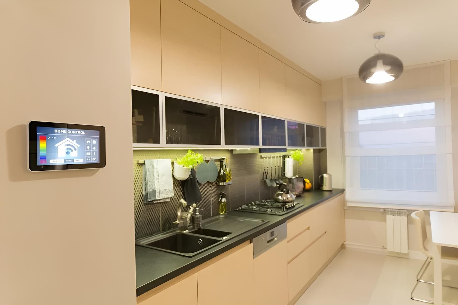 A Kitchen With a Thermostat on the Wall Above the Sink — Adept Security In Oak Flats, NSW