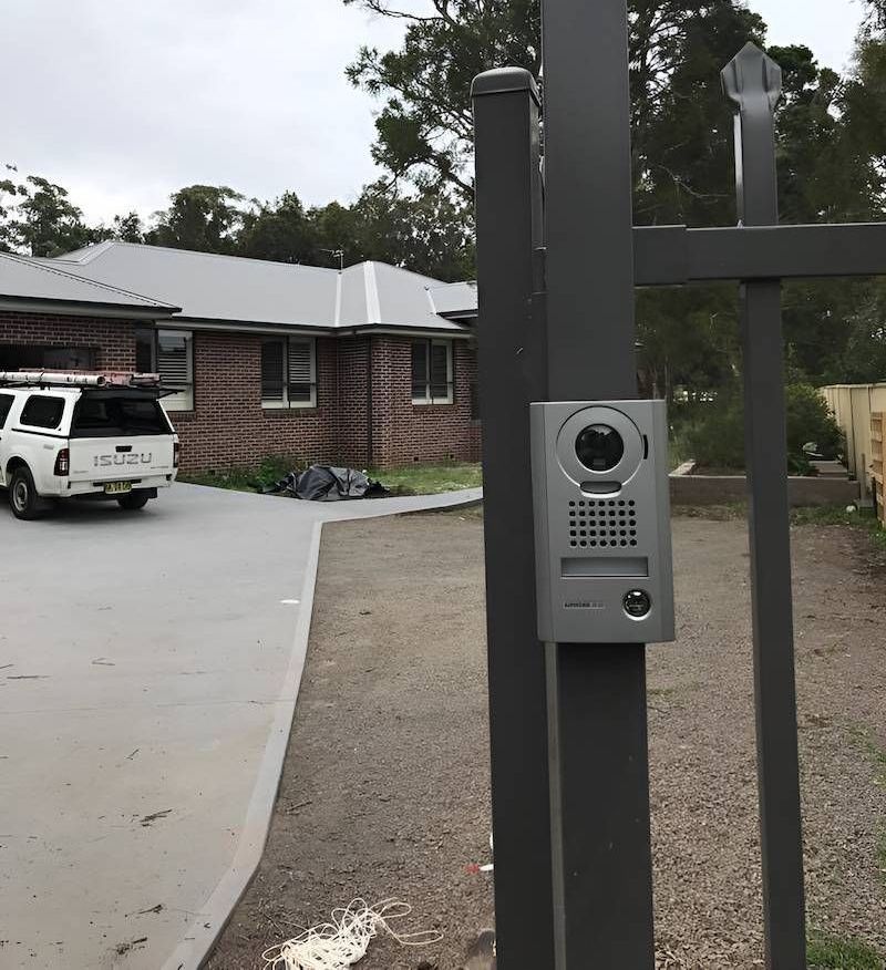 A White Truck is Parked in Front of a Brick House — Adept Security In Oak Flats, NSW