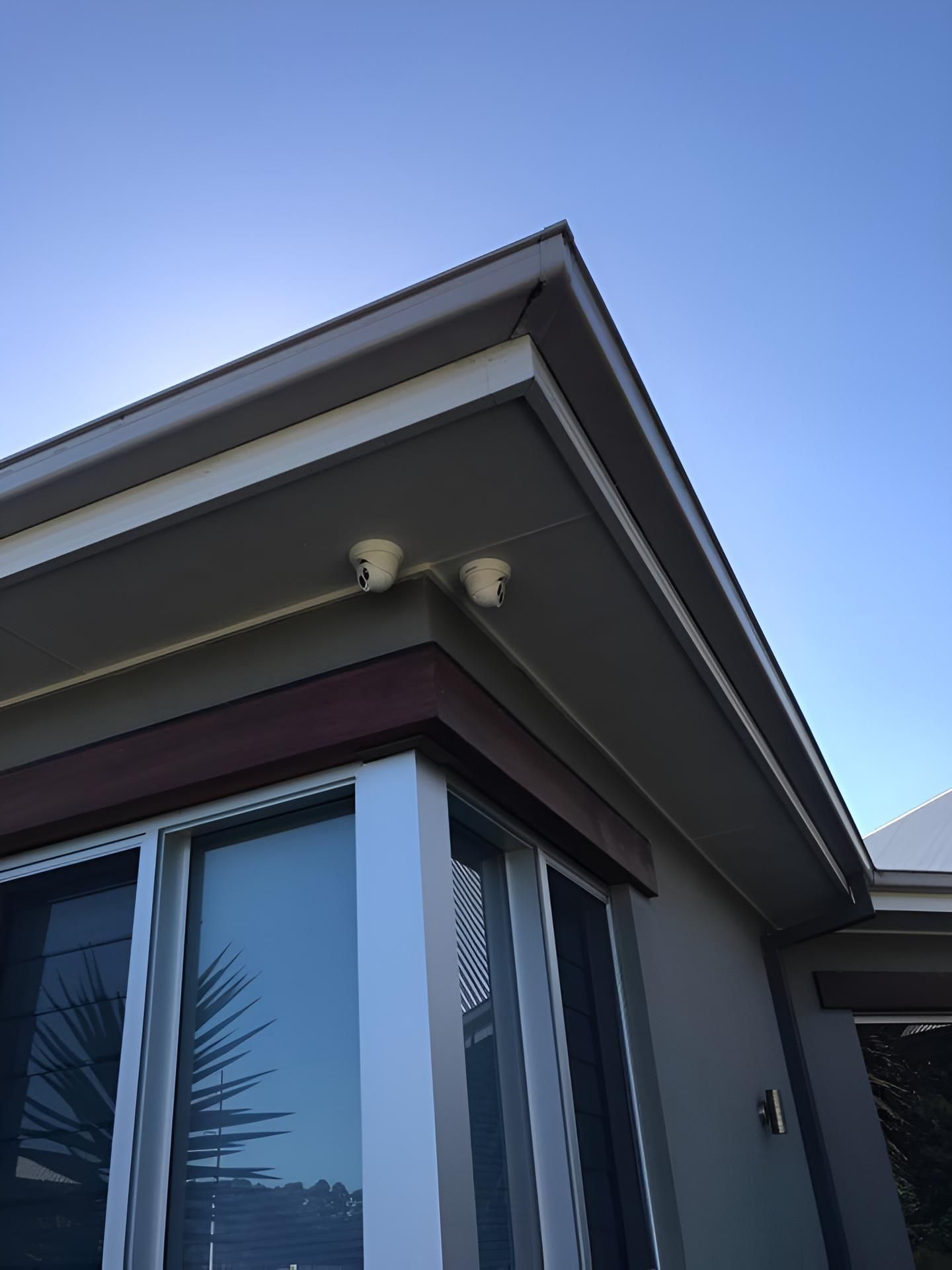 A House With a Blue Sky in the Background — Adept Security In Oak Flats, NSW