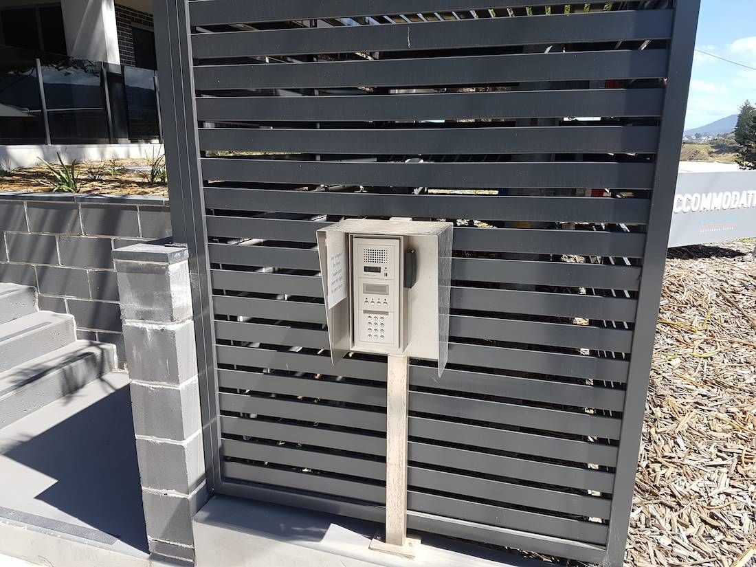 A Black Fence With a Mailbox in Front of It — Adept Security In Oak Flats, NSW