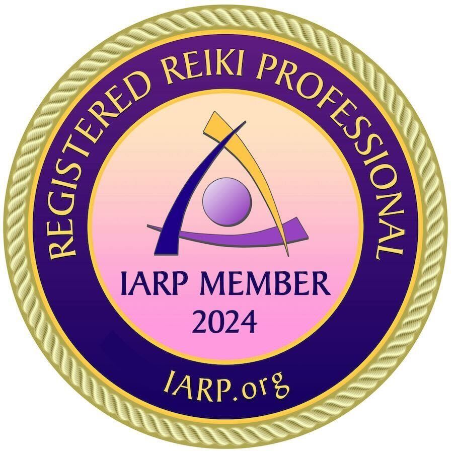 A purple and gold badge that says registered reiki professional iarp member 2024