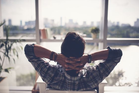 man relaxing his chair enjoying view