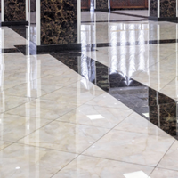 Glossy tiled lobby floor with sunlight reflections and vertical glass or metal railings