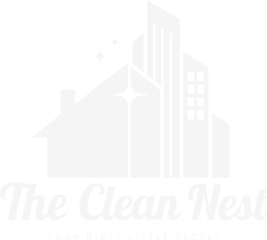The Clean Nest White “The Clean Nest” logo with a house and apartment building silhouette.