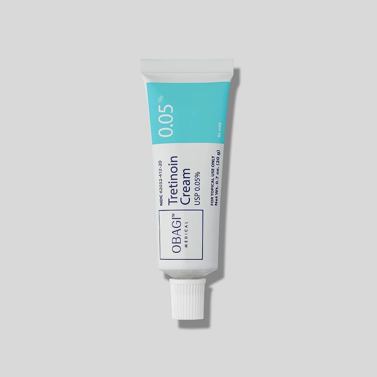 A tube of Obagi tretinoin cream is sitting on a white surface.