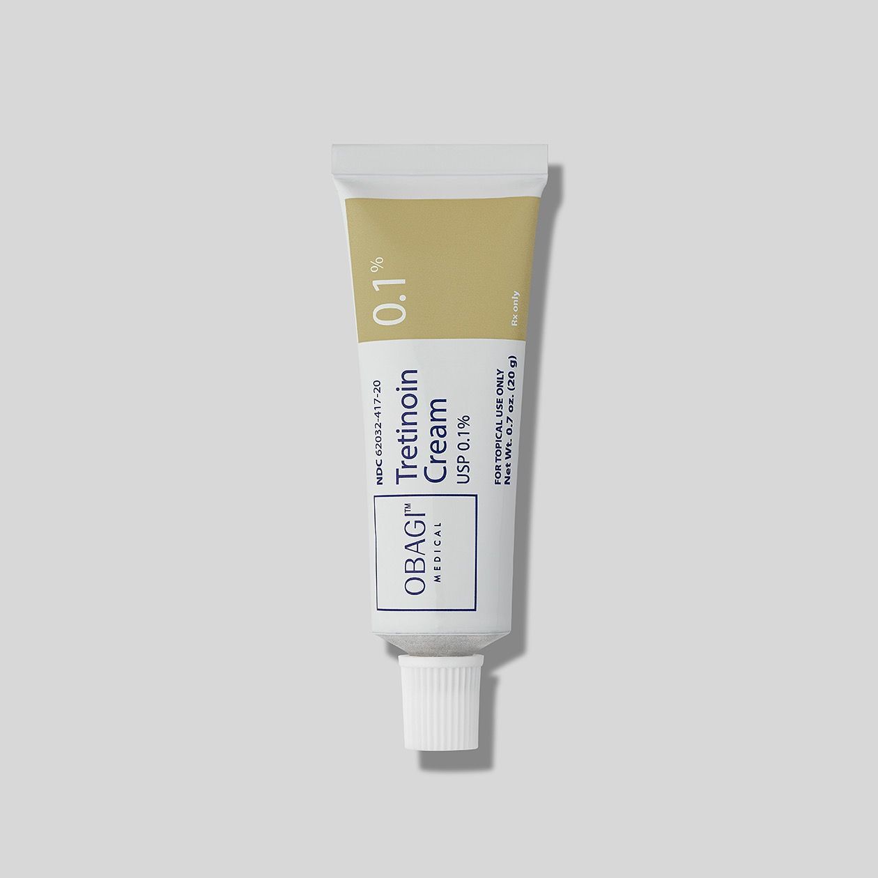 A tube of Obagi tretinoin cream is sitting on a white surface.