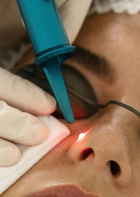 A woman is wearing a white mask on her face.