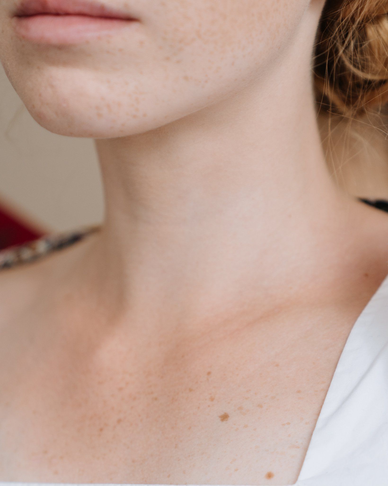 A close up of a woman 's neck and chest.