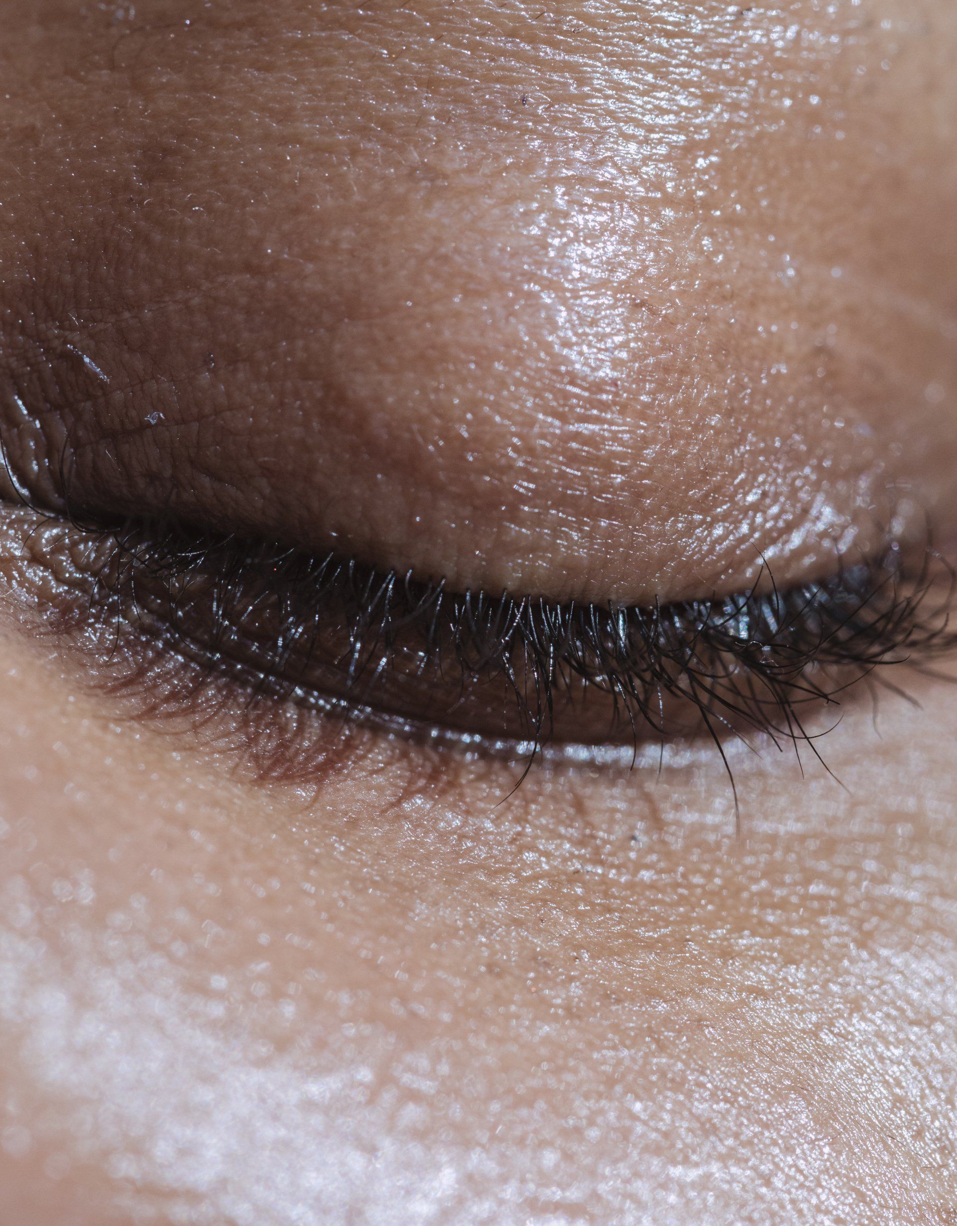 A close up of a woman 's eye with makeup on it