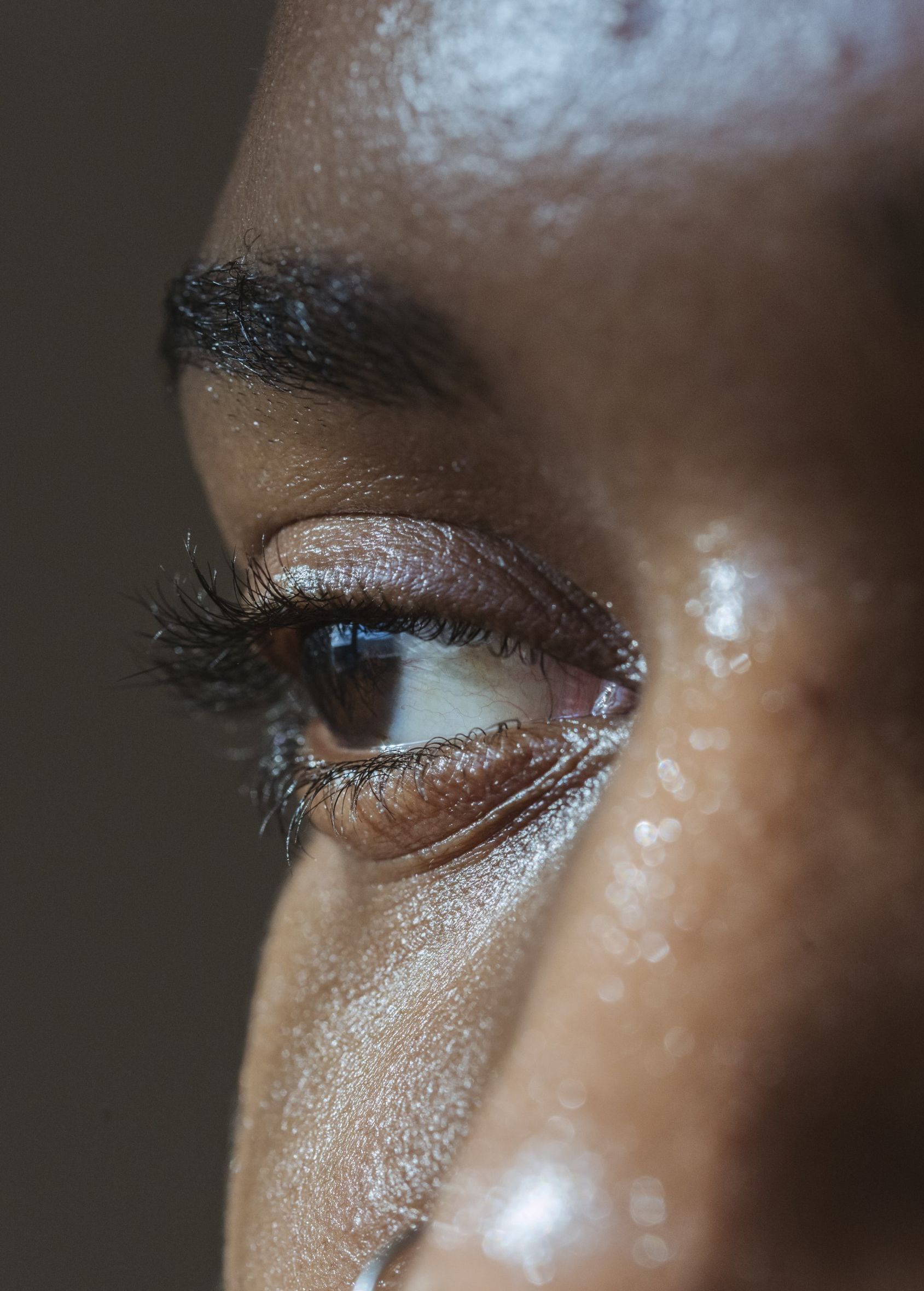 A close up of a woman 's eye with makeup on it.