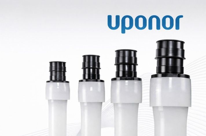 Three white tubes with black caps are lined up next to each other