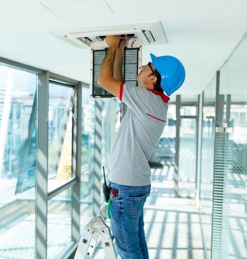 Worker Installing Air Conditioner — Salt Lake City, UT — Ace Electrical, Inc.