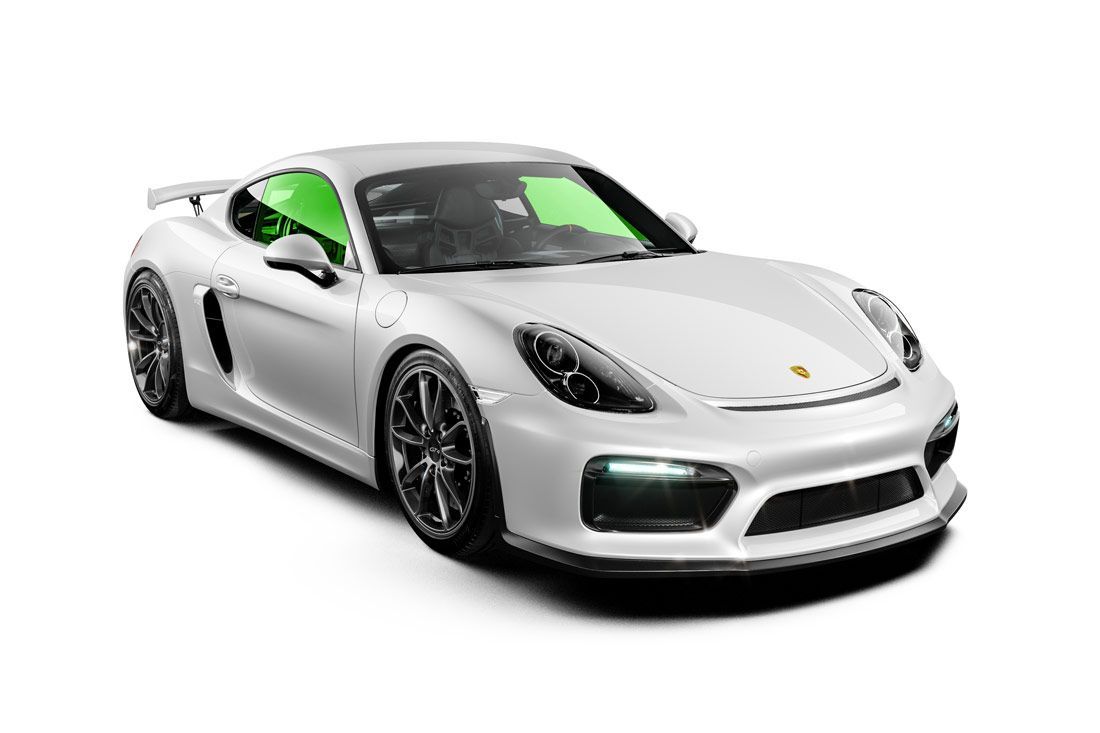 White Porsche sports car with dark wheels, green tinted windows, and black accents.