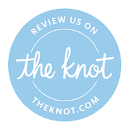 A blue circle with the words `` review us on the knot '' written inside of it.