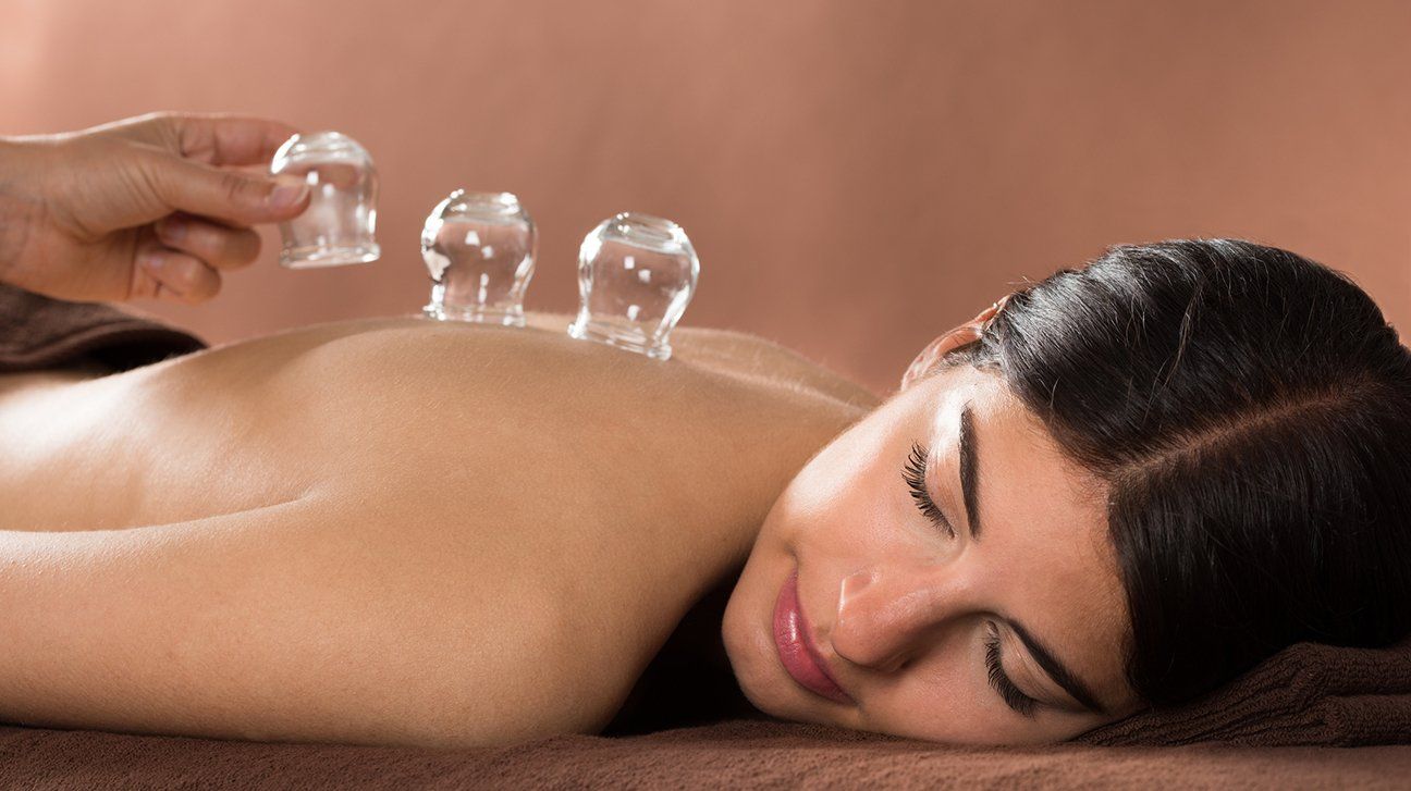 woman using cupping therapy