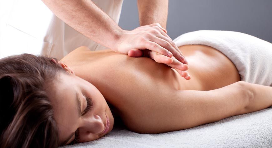 Woman getting Deep Tissue Massage