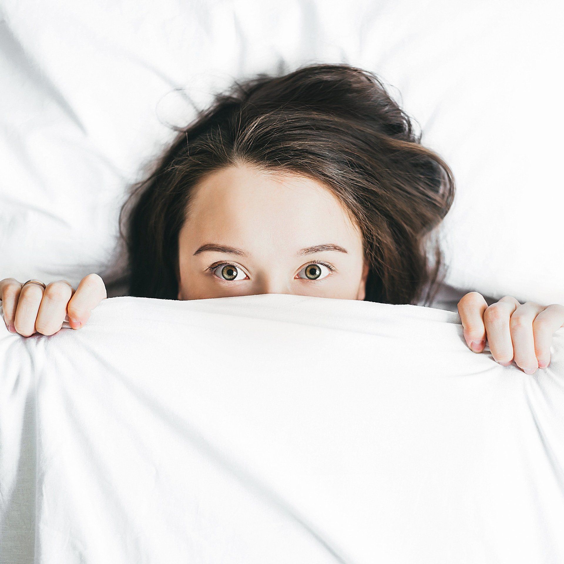 Girl Hiding Under Sheets