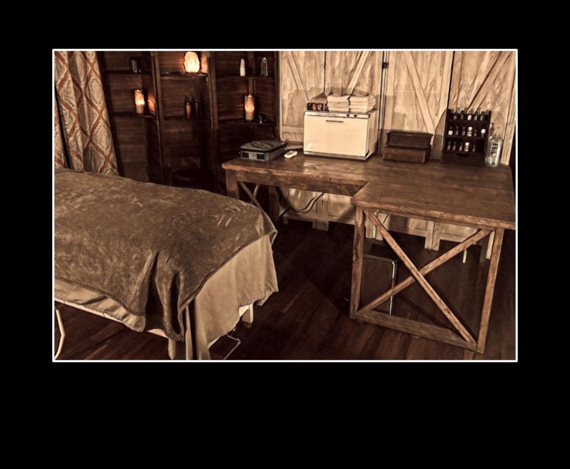 Local cryotherapy room with a treatment bed and wooden desk