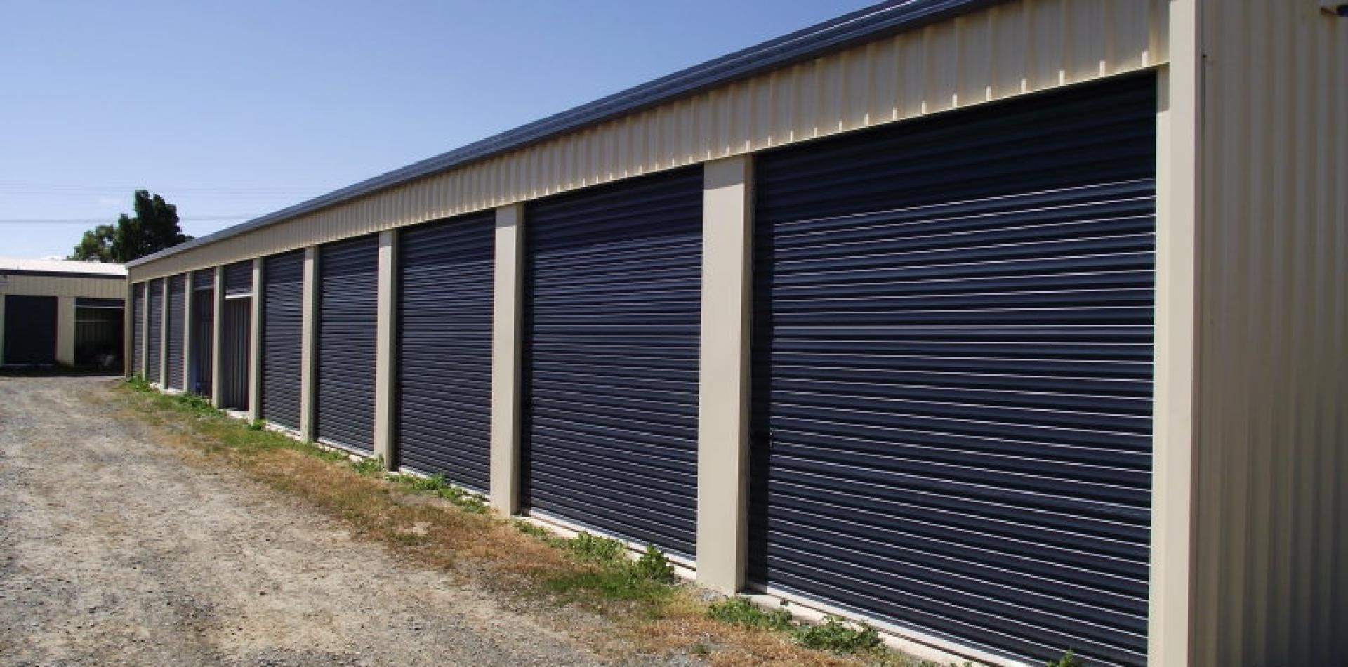 A Row Of Storage Units With Blue Doors On A Sunny Day – Mooroopna, VIC - Eezee Self Storage