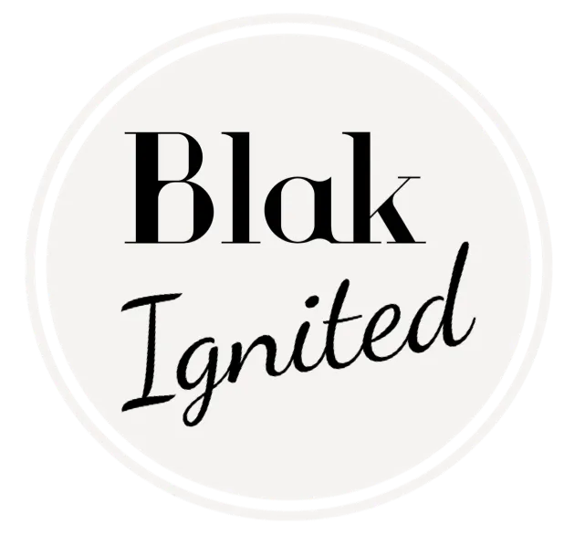 A black and white circle with the words Blak Ignited on it.